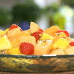 Mary Berry fresh fruit salad with mangoes, melon, papaya, passion fruit and raspberries served chilled for Sunday Lunch on Mary Berry Cooks