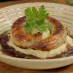 Ainsley Harriott sausages with mustard mash and a onion and red wine gravy recipe on Ainsley’s Food We Love