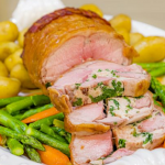 Brian Turner stuffed short saddle of English spring lamb with asparagus, carrots and Jersey Royals recipe