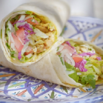 Ainsley Harriott chicken shawarma with tahini yoghurt dressing recipe on Ainsley’s Mediterranean Cookbook
