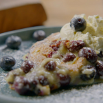 Ainsley Harriott blueberry and almond clafoutis with cardamom cream recipe on Ainsley’s Good Mood Food