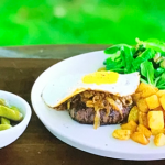 Michel Roux Jr. steak hache (BBQ minced beef with fried egg and onions) with gherkins and salad on Michel Roux’s French Country Cooking