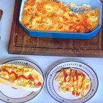Lisa Faulkner mac and cheese with vegetarian frankfurters hot dogs and caramelised onion recipe on John and Lisa’s Weekend Kitchen