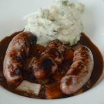 Rick Stein bangers and mash with BBQ Lincolnshire sausages and red wine gravy recipe on Rick Stein’s Food Stories