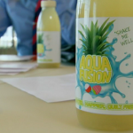 Big Dawg passion fruit drink takes on Aquafusion pineapple drink on The Apprentice  2014 advertising task in New York