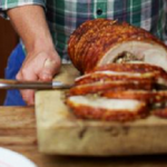 Stuffed roast pork known as the Italian porchetta by  Jamie Oliver and Jennifer Saunders on Jamie and Jimmy’s Friday Night Feast