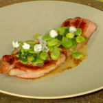 Bacon Chop with broad beans and broad beans flowers on Spring Kitchen with Tom kerridge