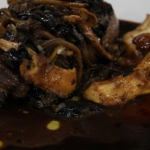 James Martin rib-eye steak with wild mushrooms and red wine sauce recipe