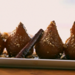 Ainsley Harriott Blue mountain coffee and rum poached pears with crunchy coconut crumb recipe on Ainsley’s Caribbean Kitchen