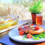 Ainsley Harriott Pan-Fried Thyme and Garlic Pork Chops with Blistered Tomatoes and Maltese Baked Potatoes recipe