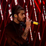 Zayn Malik sports new hair style with ponytail on The X Factor Results Show where One Direction performs Steal My Girl